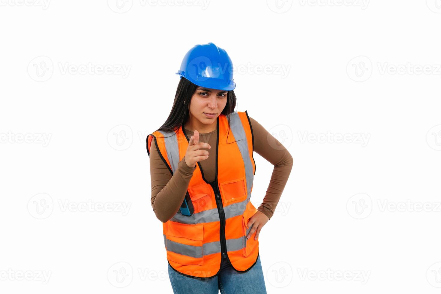 Confident latin construction worker pointing forward on white background photo