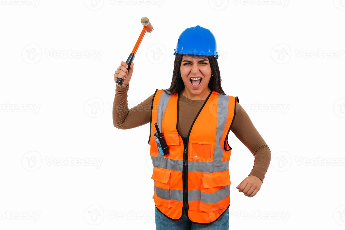 Angry latin construction worker woman holding hammer and screaming photo