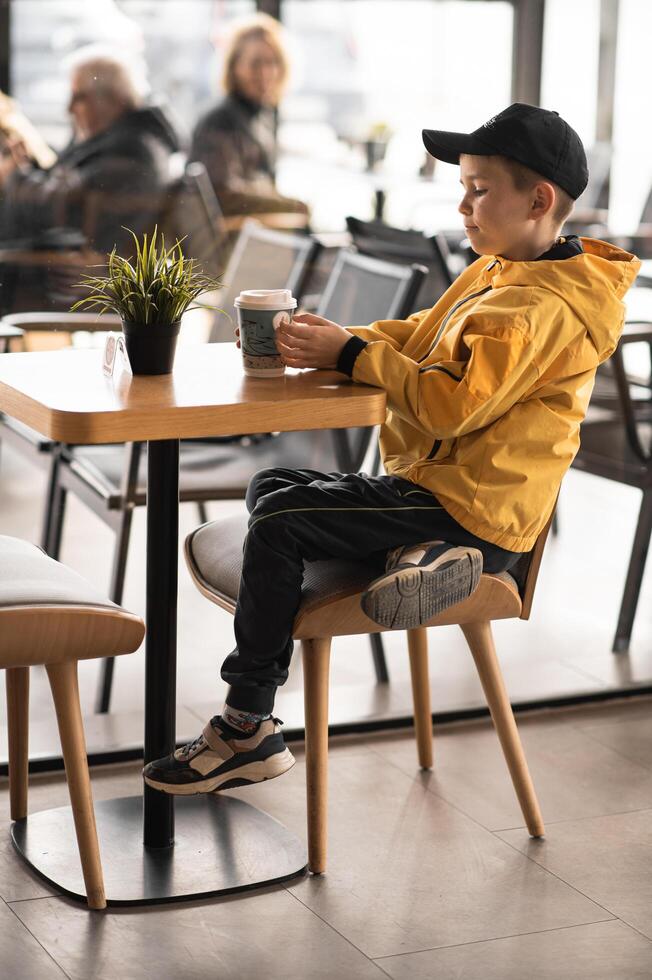 Time slows down he sits with coffee in hand, anticipation and quiet contemplation in his expression. photo