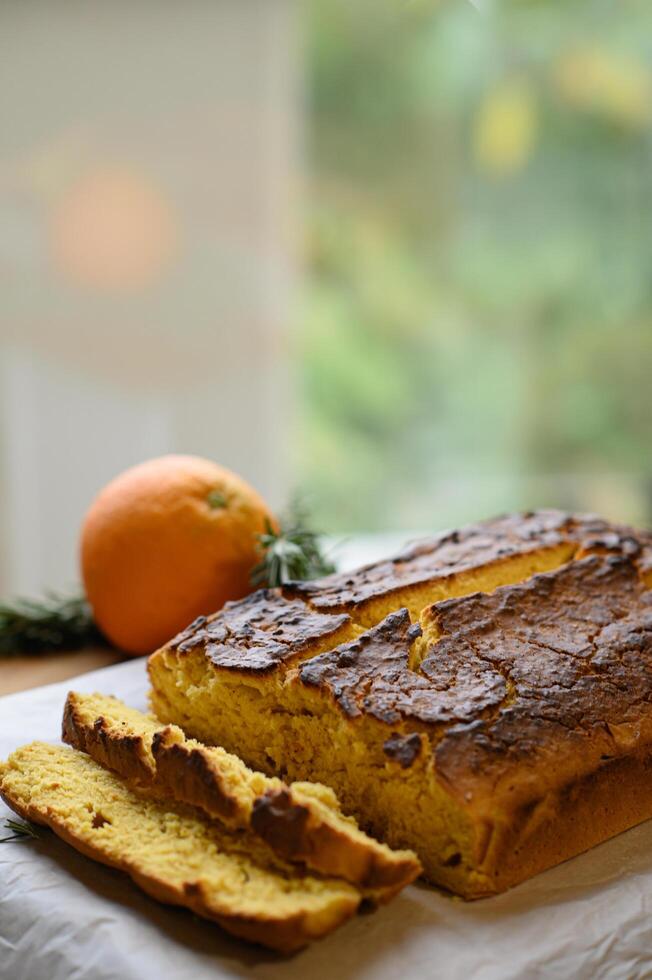 A warm, citrus-infused cake glows under soft natural light, its tender crumb and delicate glaze capturing the essence of homemade comfort. photo