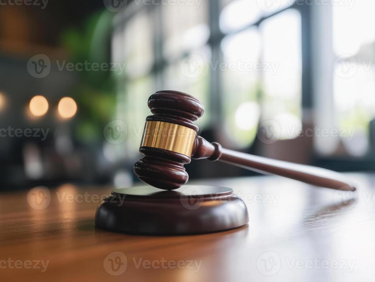 Judge gavel resting on sound block in courtroom setting symbolizing justice photo