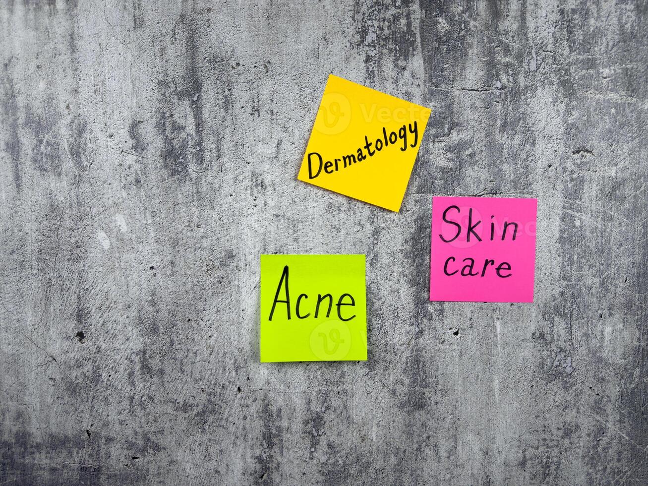 Dermatology concept with conceptual peeled background resembling rough skin. The importance of taking care of your body and removing acne. Words on sticky notes with skin health theme photo