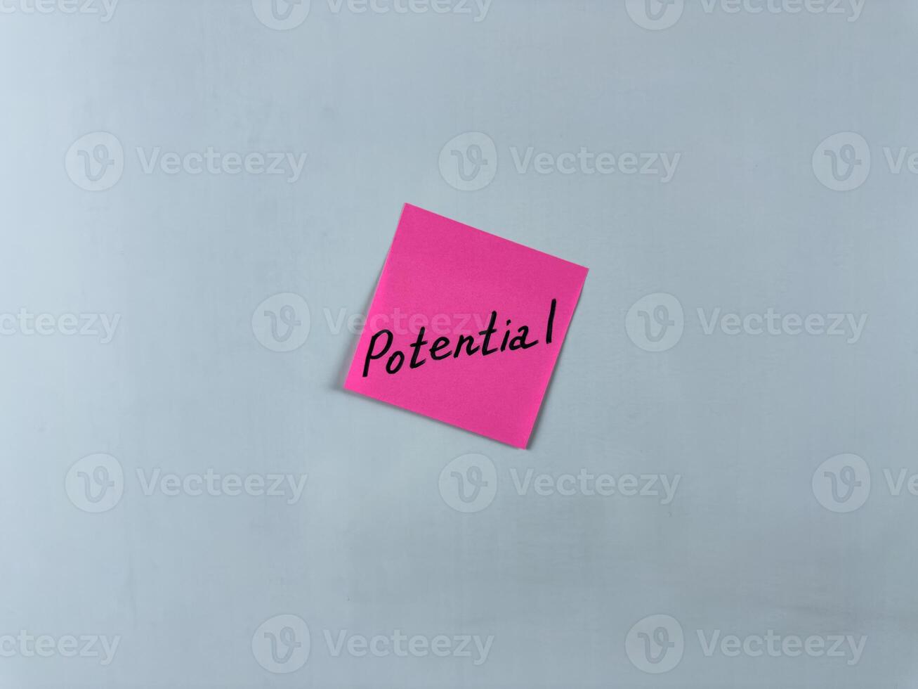 Sticky note with Potential written on it, set on a white background. This image symbolizes growth, opportunity, and capability, suitable for illustrating concepts of potential and future success photo