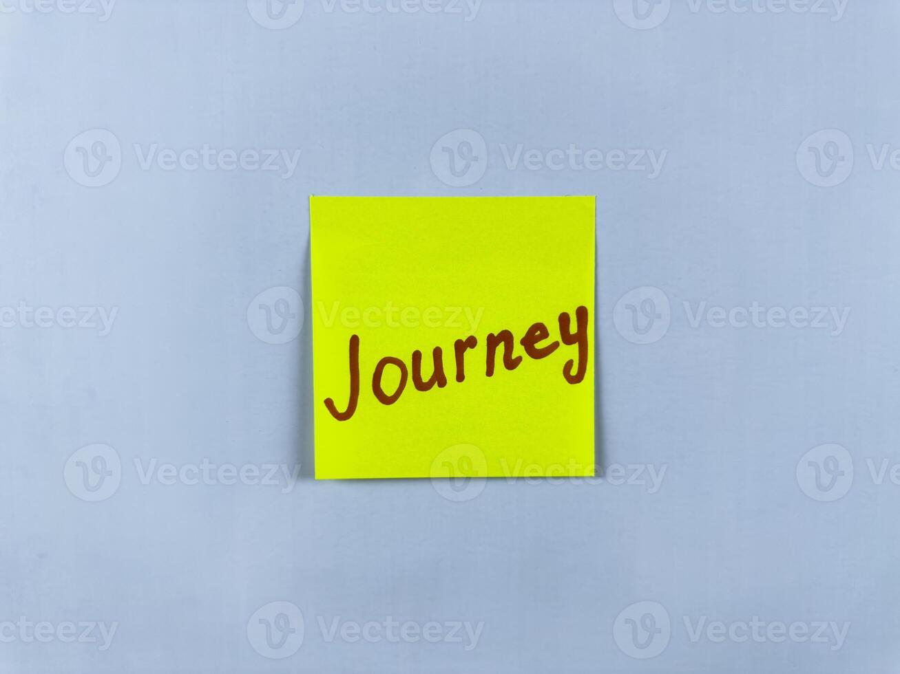 Sticky note with the word Journey written on it, placed on a white background. Ideal for illustrating themes of travel, adventure, and personal growth. Great for concept creation photo