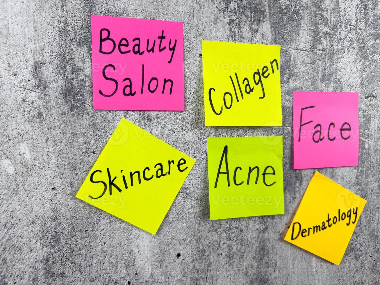 Conceptual photo for article about skin care. Drawing attention to skin problems and acne removal with colored sticky notes. Reminder with words about caring for your body and epidermis