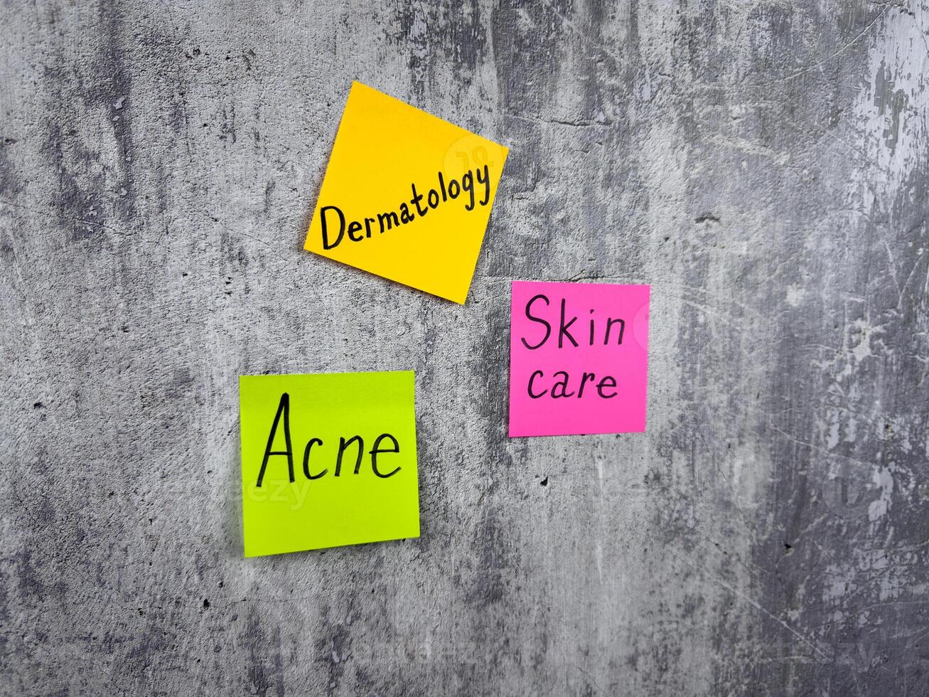 Conceptual photography to remind about the importance of skin care. Epidermis protection and healthy skin. Post it notes with words about the importance of treating skin problems photo