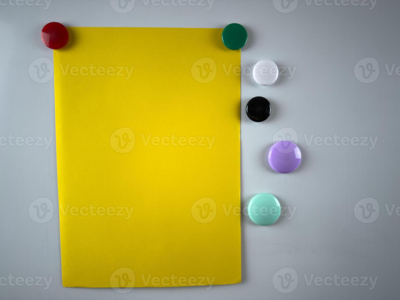 Note attached to whiteboard using variety of magnets, enhances organizational and planning efforts in both educational and corporate settings ideal for boosting productivity photo