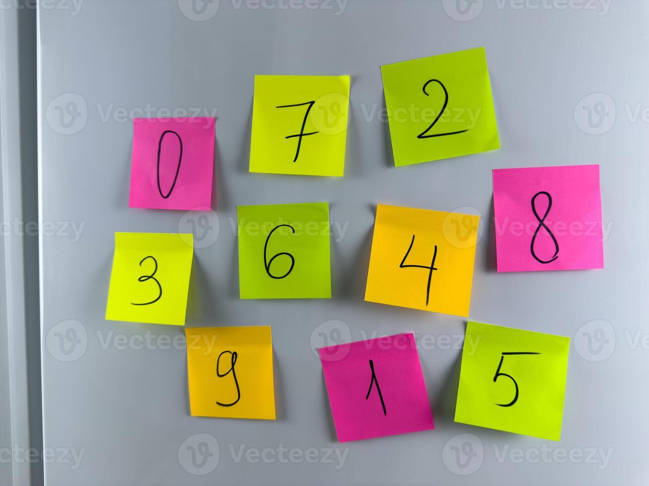 Simple way to help child remember numbers with colored stickers hanging on refrigerator photo