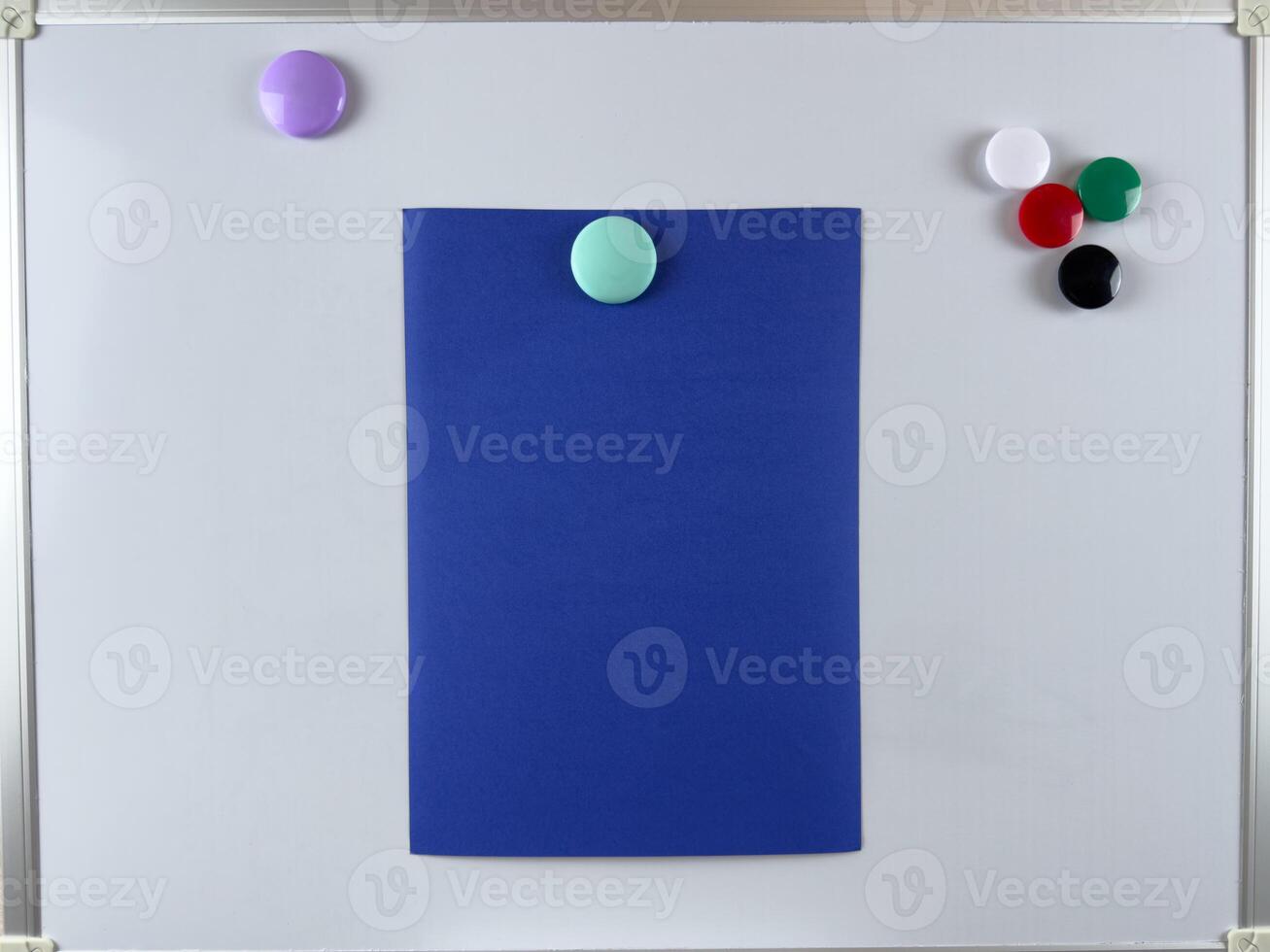 Note paper attached to whiteboard with magnets. Perfect for notes reminders and task tracking in educational and professional environments. Improving organization and productivity photo