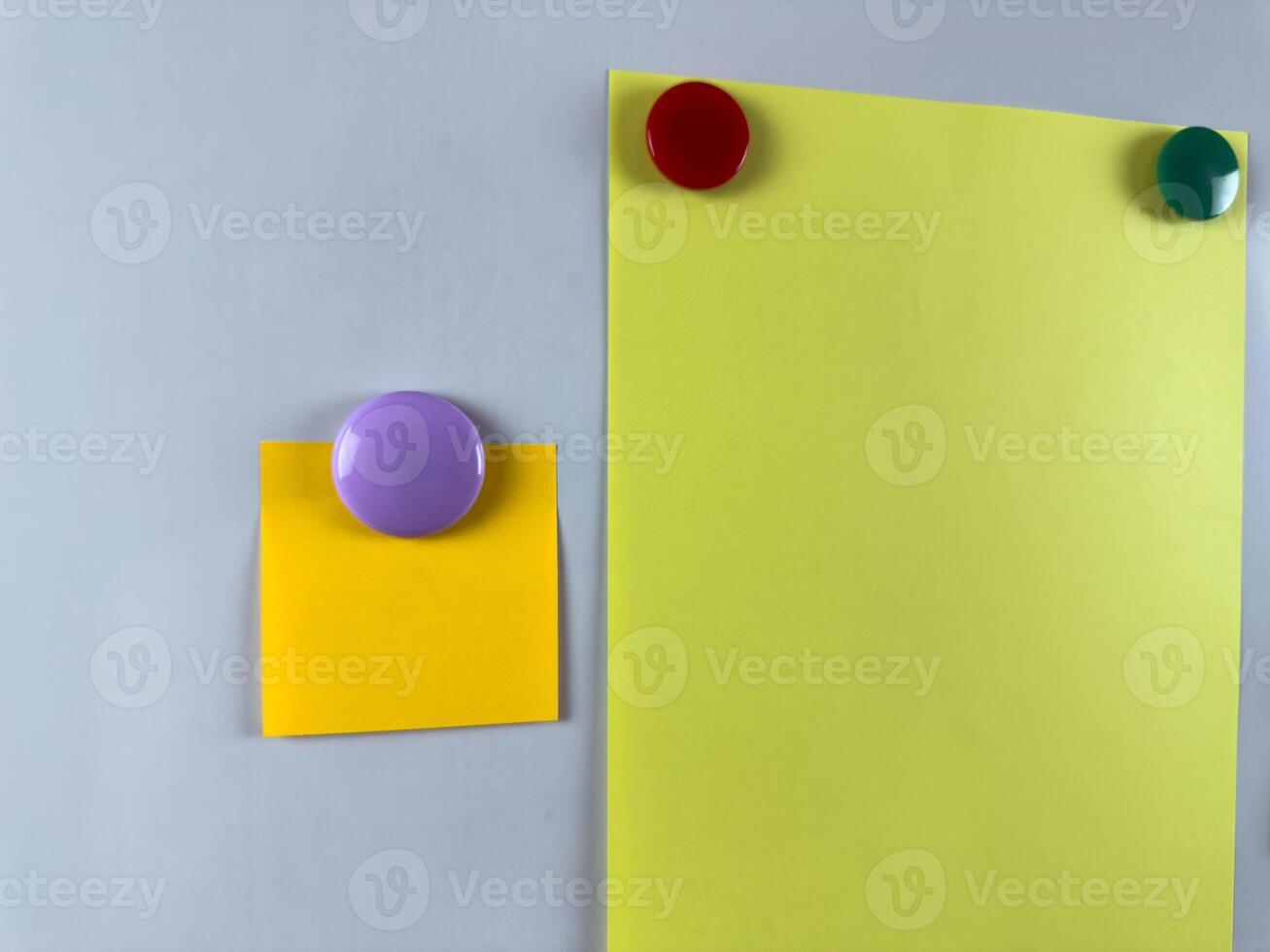 Whiteboard with various notes attached by magnets perfect for organizing tasks and reminders. Increasing productivity and efficiency in office. Classroom education with notes photo