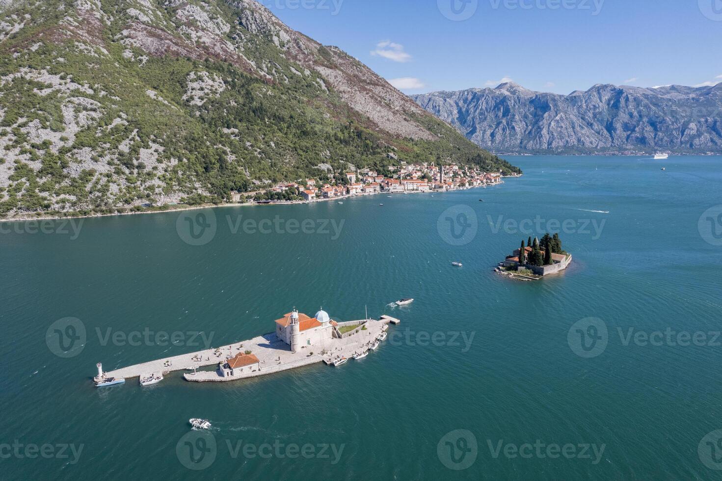 Island of Gospa od Skrpjela against the backdrop of the island of St. George. Montenegro. Drone photo
