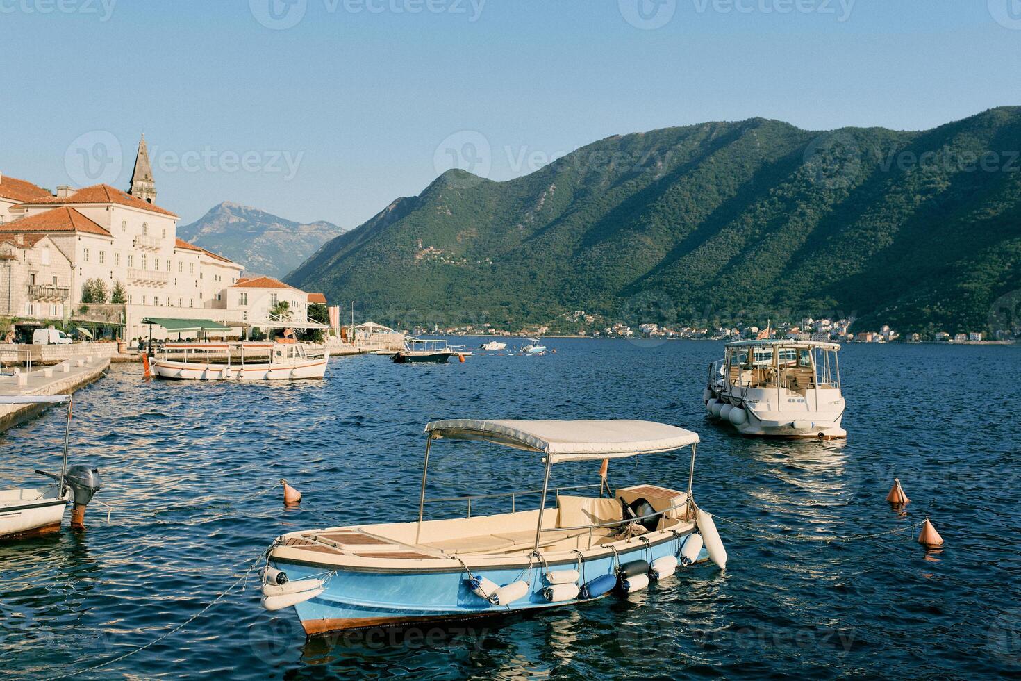 Excursion boats are moored off the coast of Perast. Montenegro photo