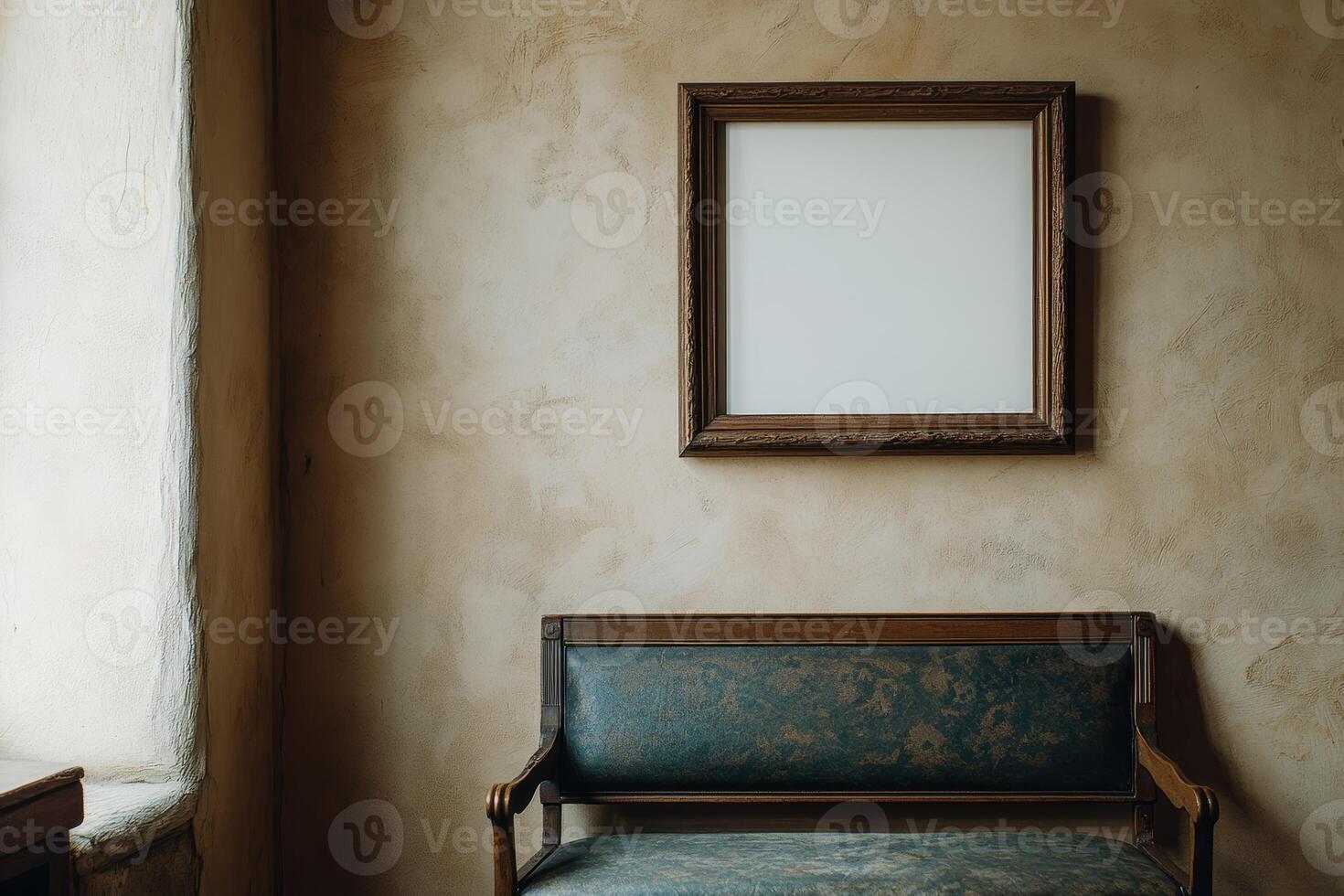 An empty frame sits on a wall next to a chair photo