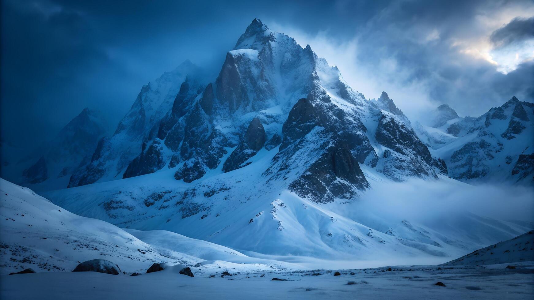 snowy mountain peaks covered in mist with dramatic light, ideal for winter backgrounds, travel, adventure, and wilderness themes photo