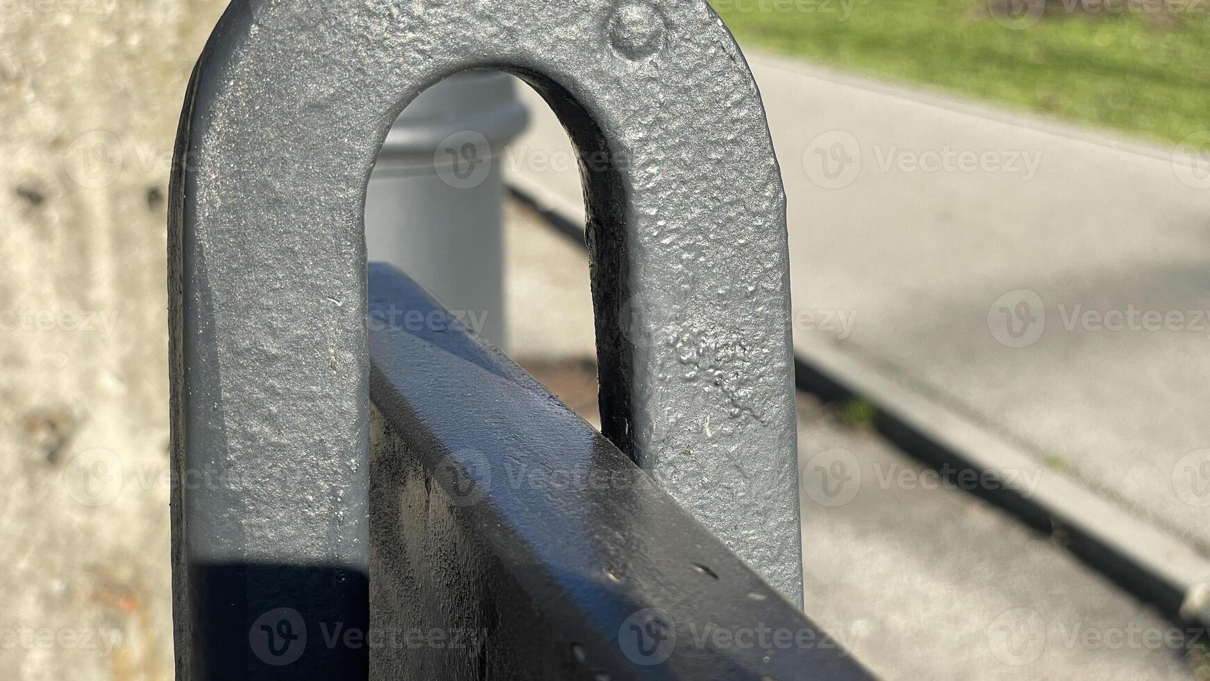 Capturing the play of light on weathered metal in a city park on a sunny afternoon photo