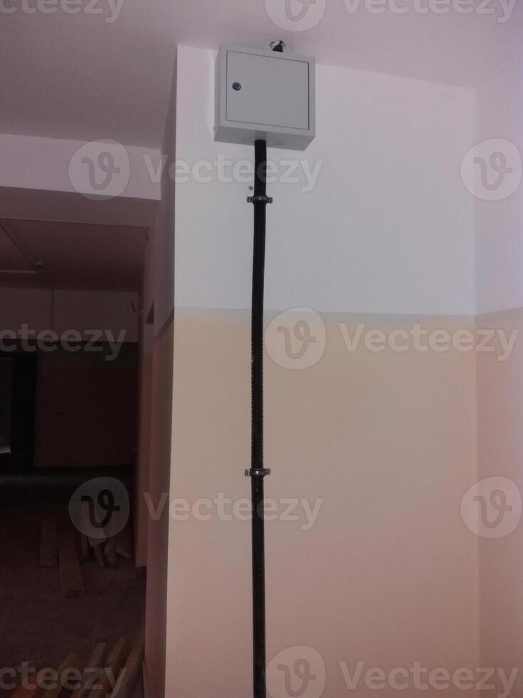 Electrical installation revealed within a newly renovated indoor space during construction work photo