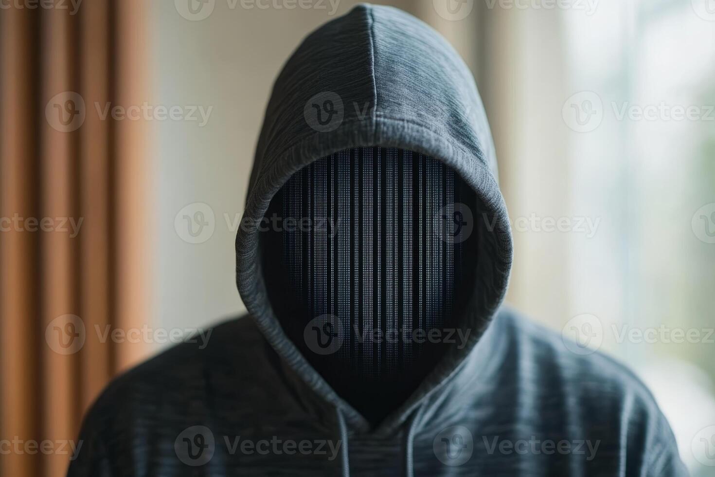 Internet scammer hacker concept . Mysterious figure in a hooded sweater with a digital face in a softly lit indoor setting photo
