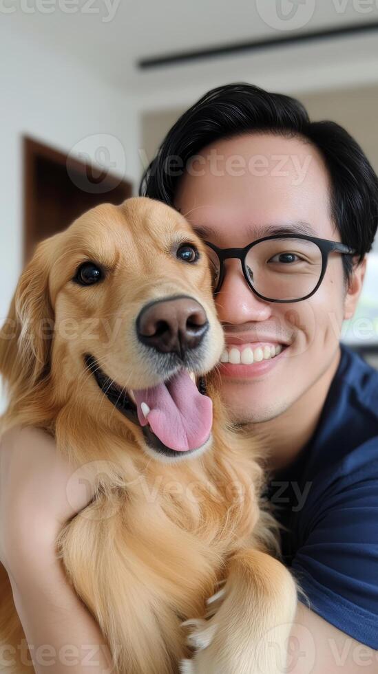 Happy man embraces his golden retriever in a cozy indoor setting showcasing friendship and joy photo
