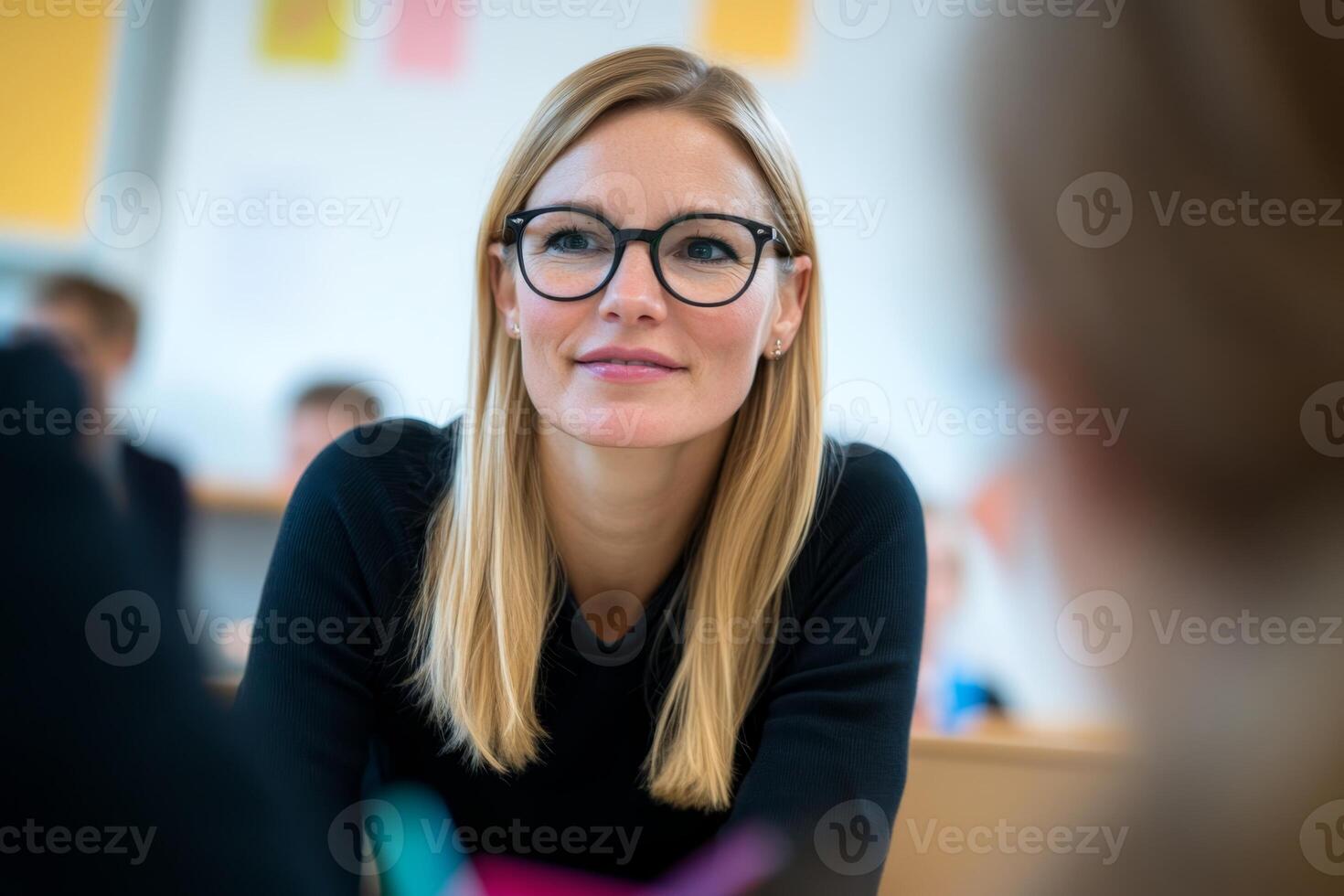 Student engages with instructor during classroom discussion in a modern educational setting photo