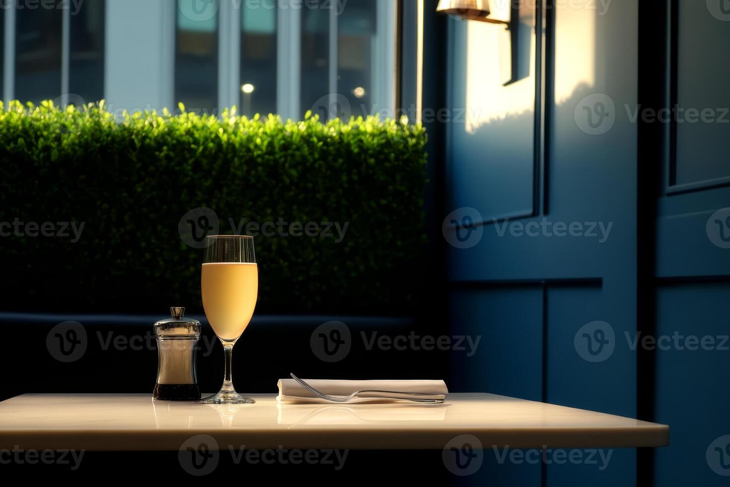 Refreshing mimosa on a sunny table in a cozy cafe with green plants in the background and soft light photo