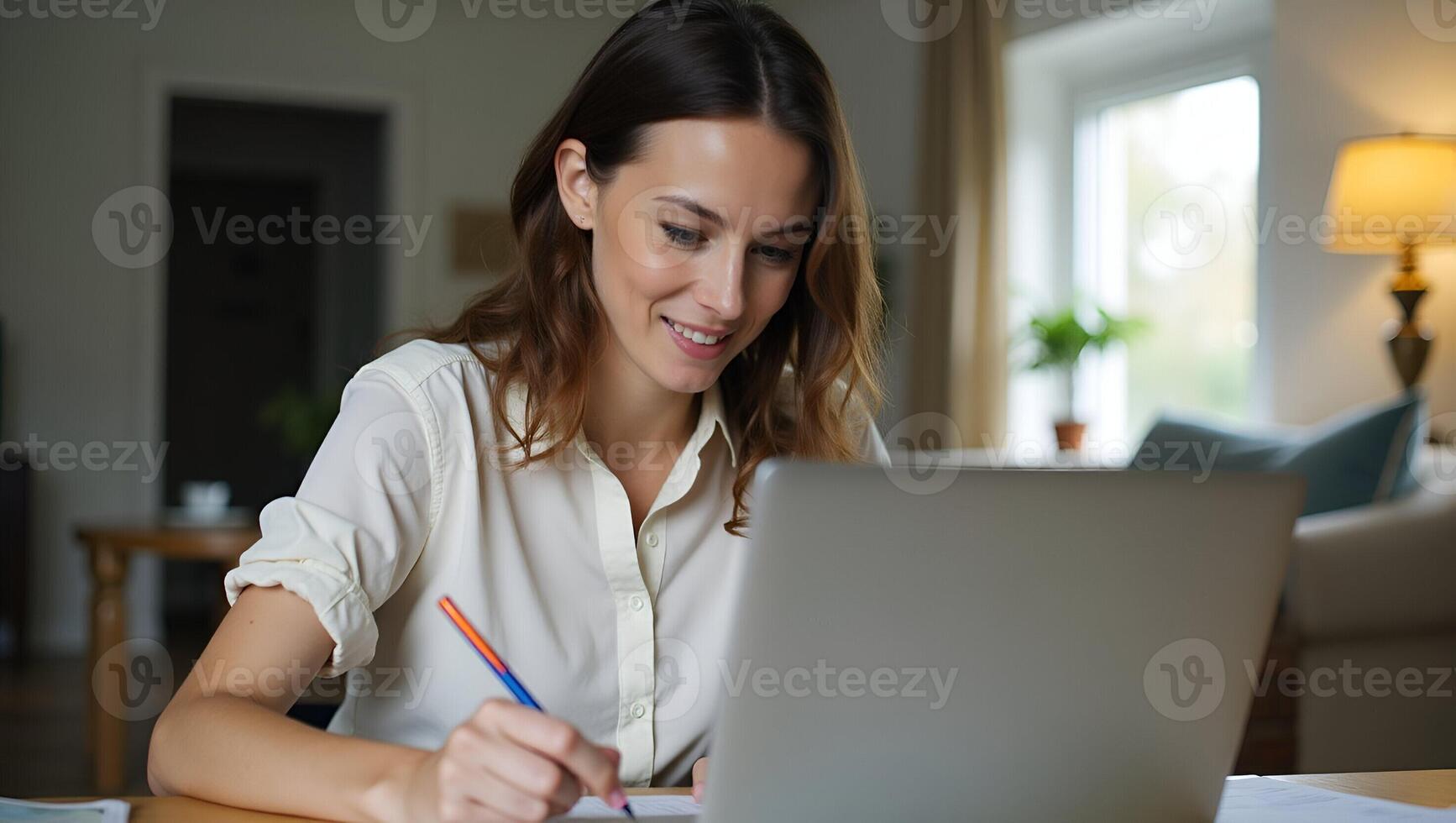 Young female student engages in e learning or remote work at home office using laptop for webinars online training digital education sits at table writing notes concept as Young fe Realistic Set 2 photo