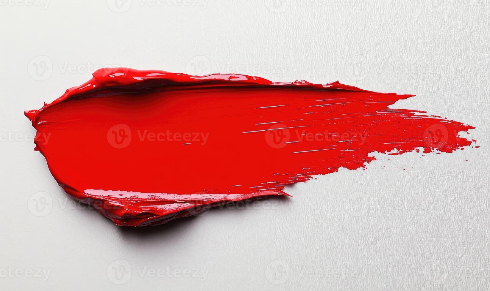 a red paint splatter on a white surface photo