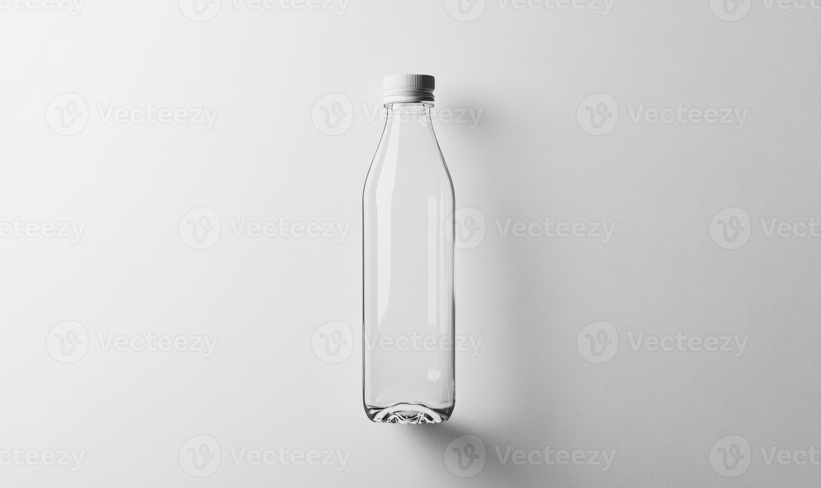 a clear plastic bottle on a white surface photo