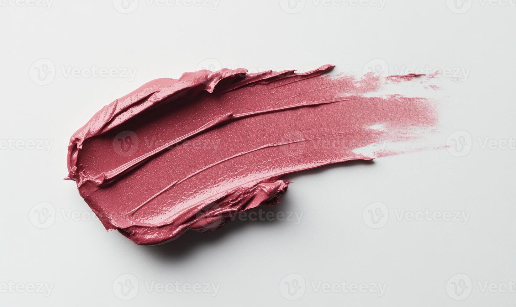 pale oink lipstick stroke on white background photo