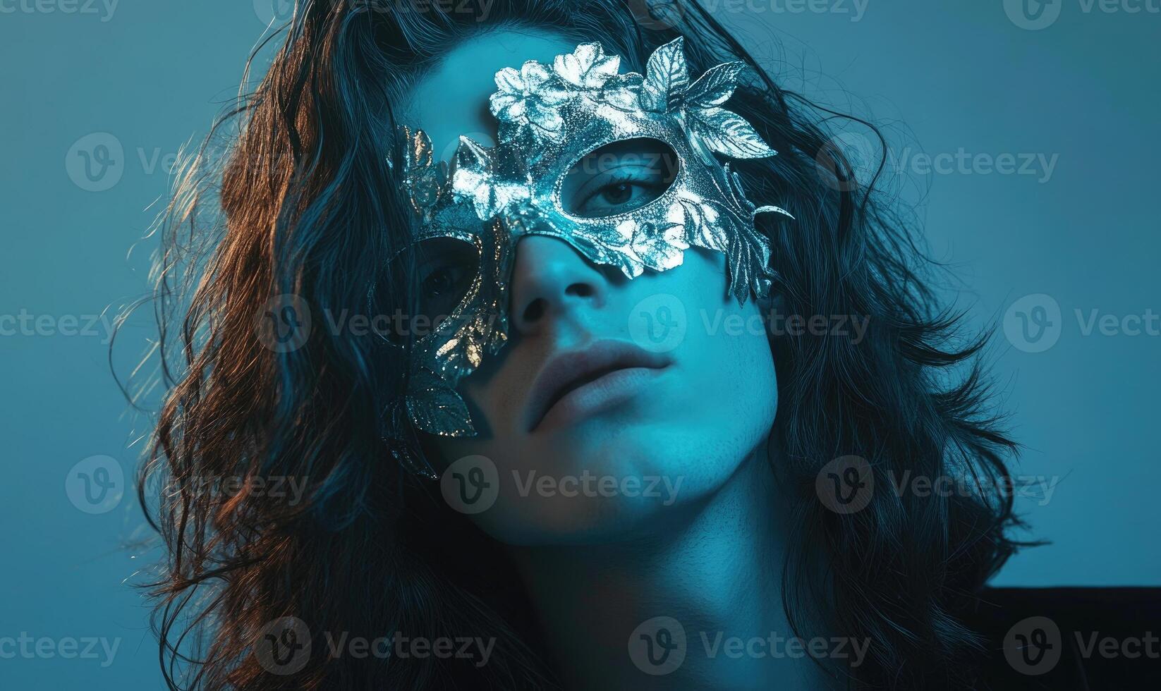 a woman with a silver mask on her face photo
