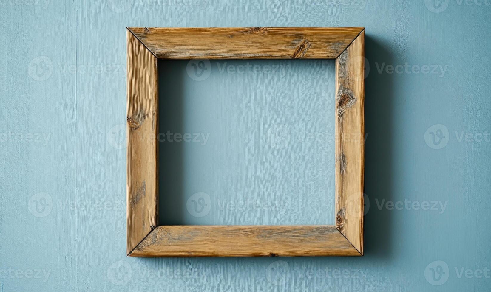a wooden frame hanging on a blue wall photo