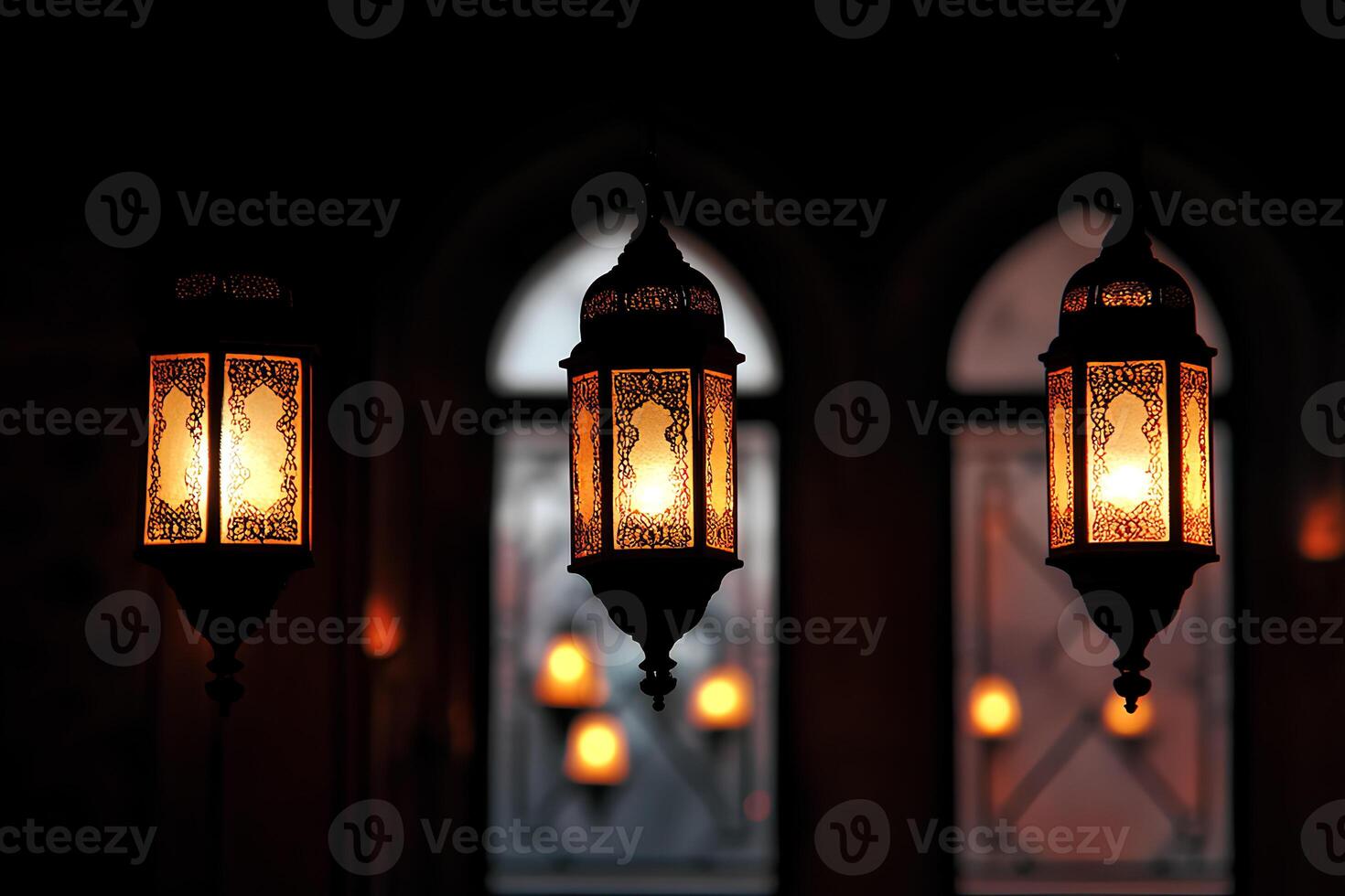 Beautiful lanterns glowing inside a mosque at night, creating a peaceful and festive atmosphere during Ramadan Kareem photo