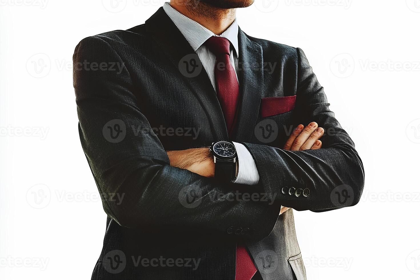 A cropped image of a confident businessman in a suit, with arms crossed, against a clean white background, symbolizing professionalism and authority photo