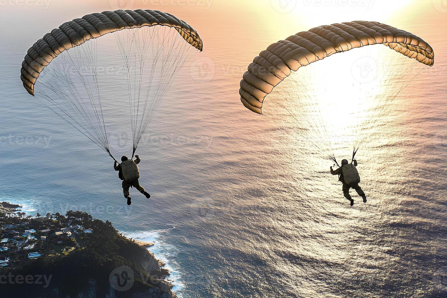 Paragliders soaring above the ocean with a vibrant sunset sky in the background photo
