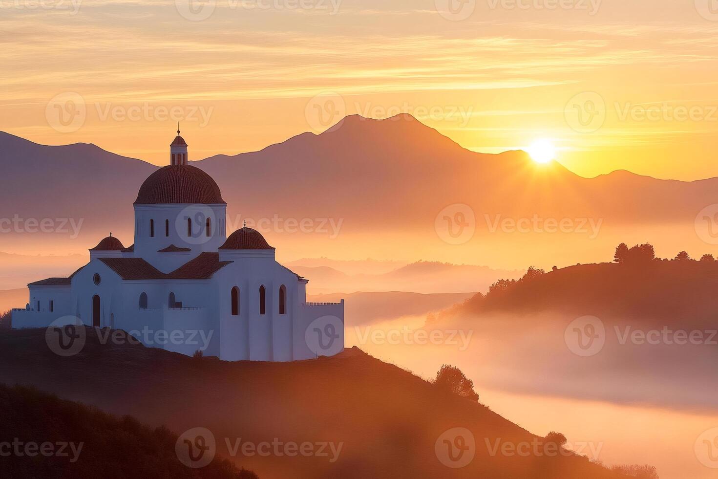 Sanctuary of Saint Michael of the Archange, golden sunrise illuminating fog over the hills of Puglia photo