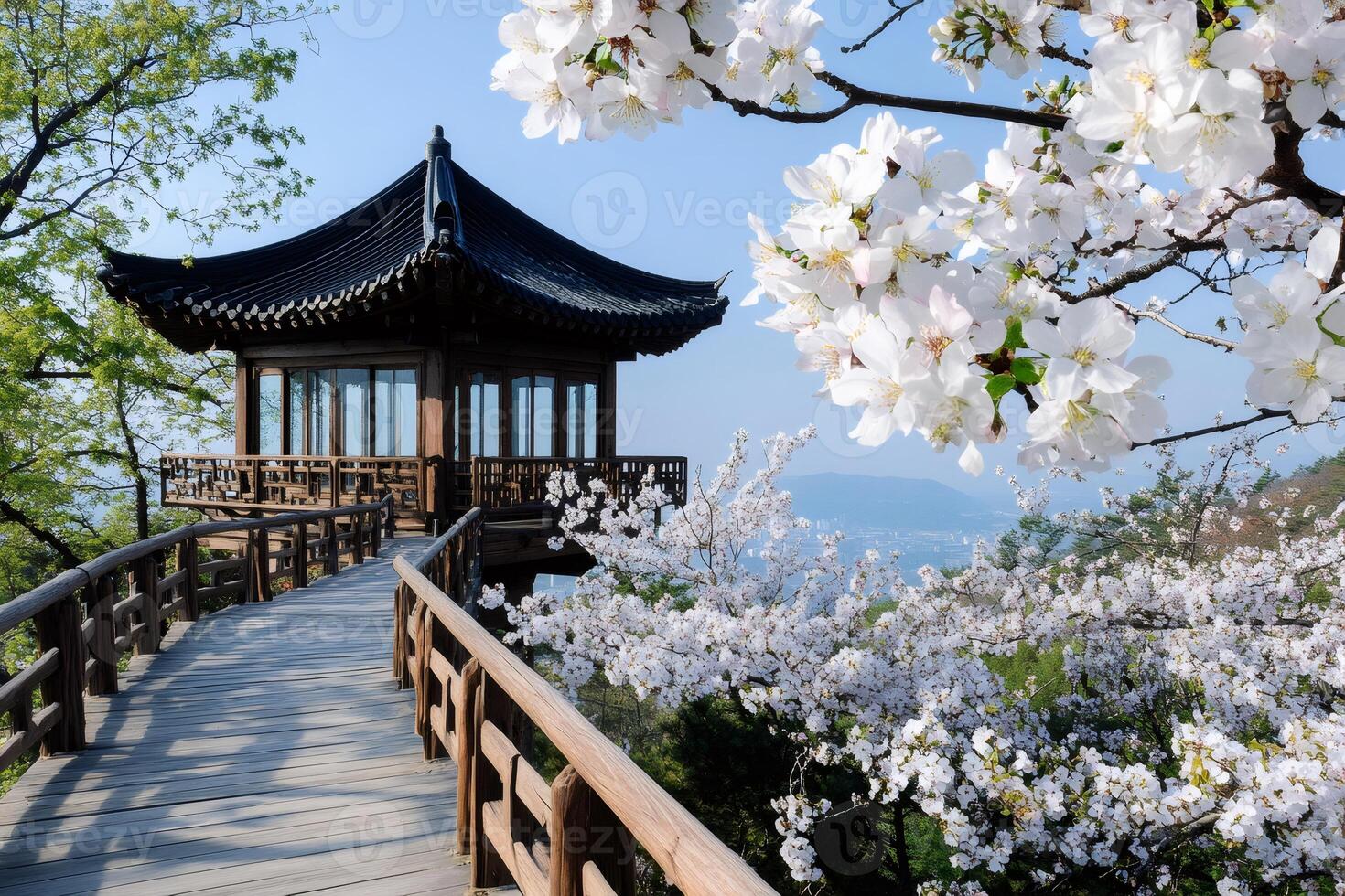 Wooden walkway leading to pavilion surrounded by cherry blossoms in full bloom photo