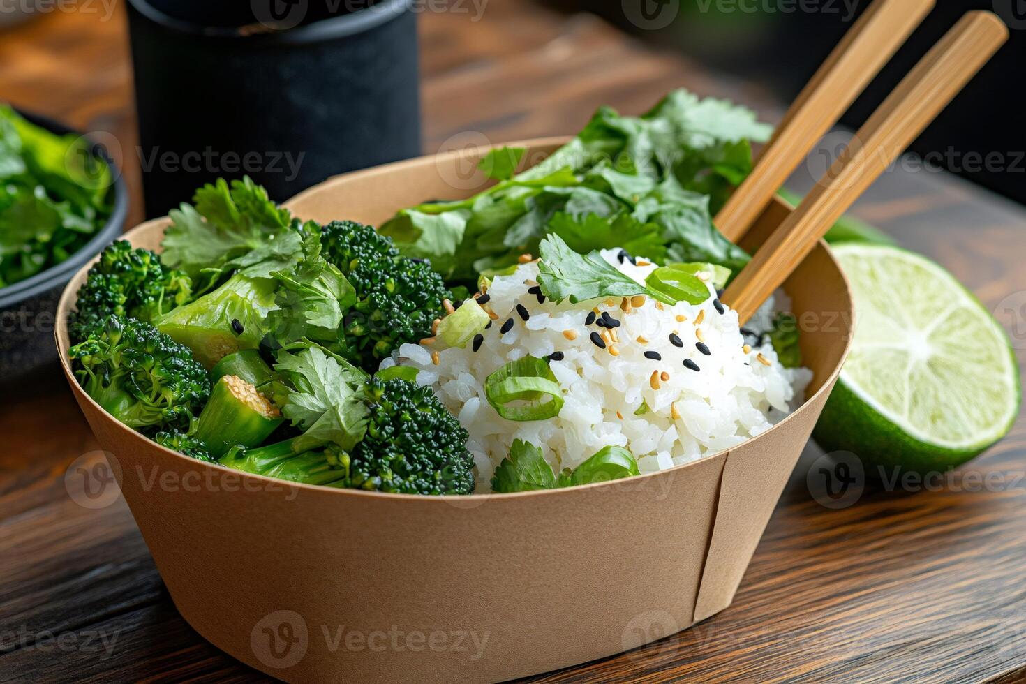 Disposable bowl with rice, broccoli and coriander seasoned with sesame and chives photo