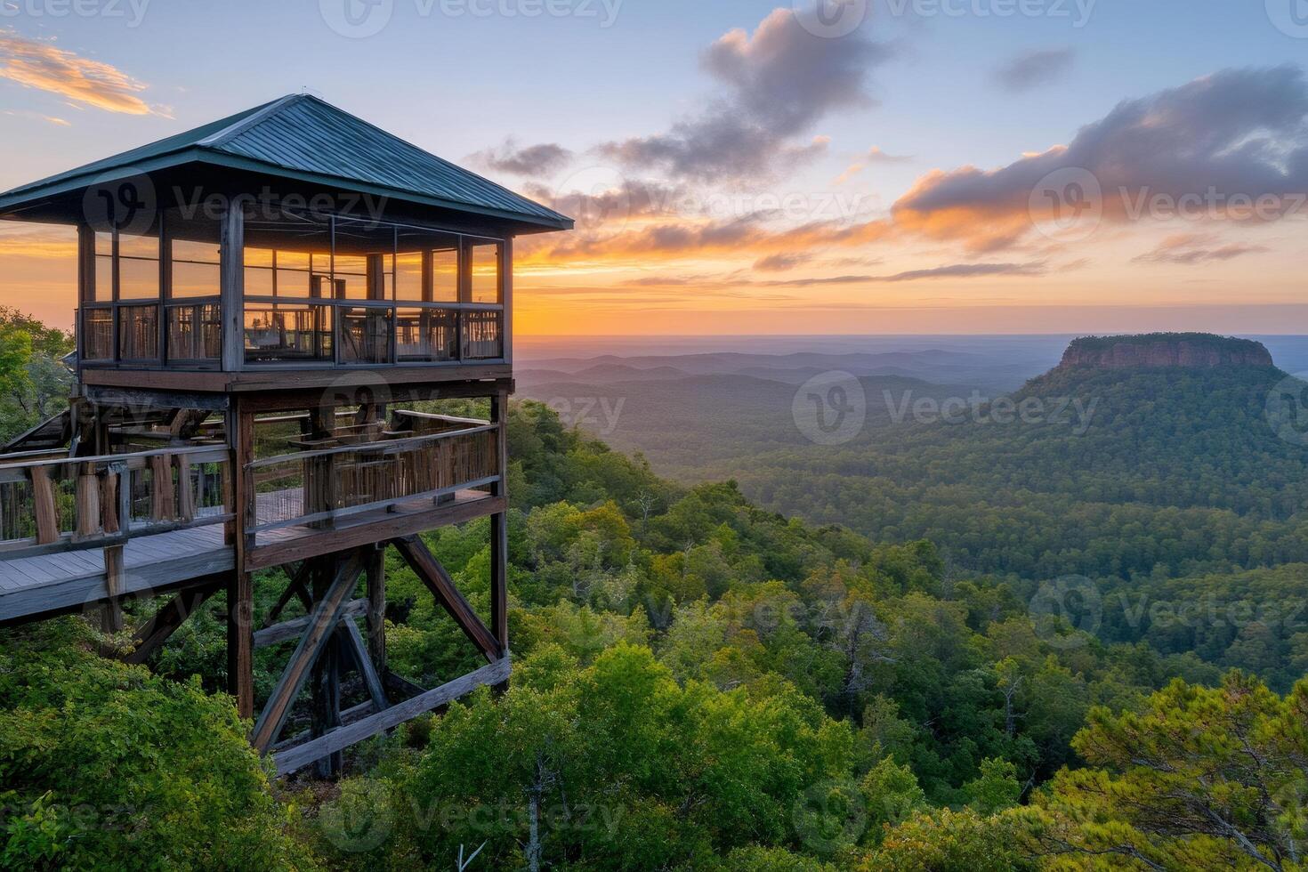 Wooden observation tower overlooking Mount Magazine State Park at sunset photo