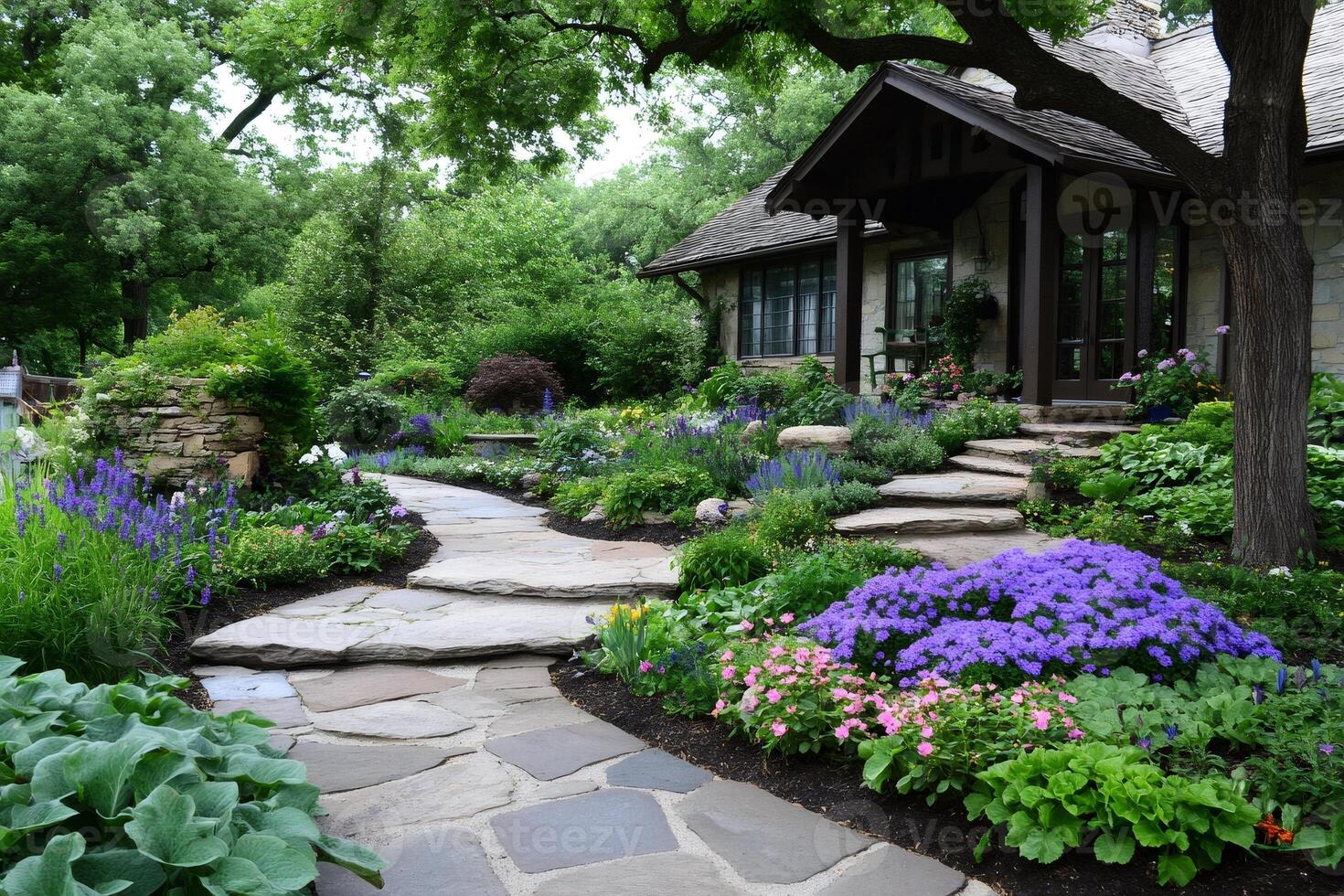 Stone path winding through a colorful perennial garden leading to a cozy house photo