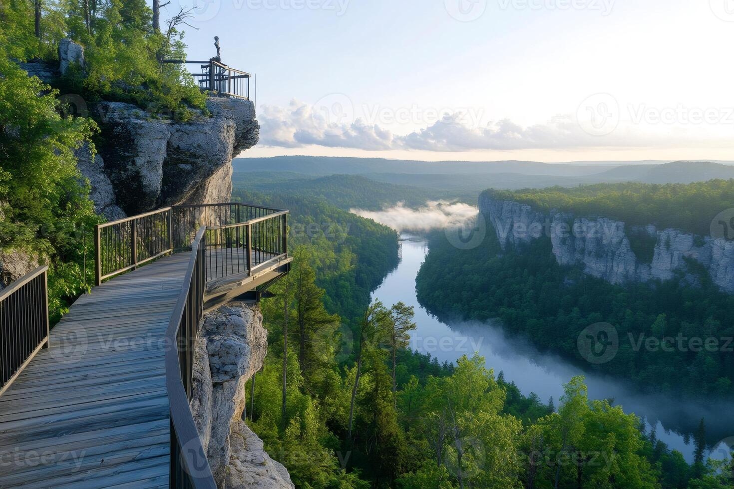 Wooden walkway leading to scenic overlook at sunrise over Big Piney River in Missouri photo