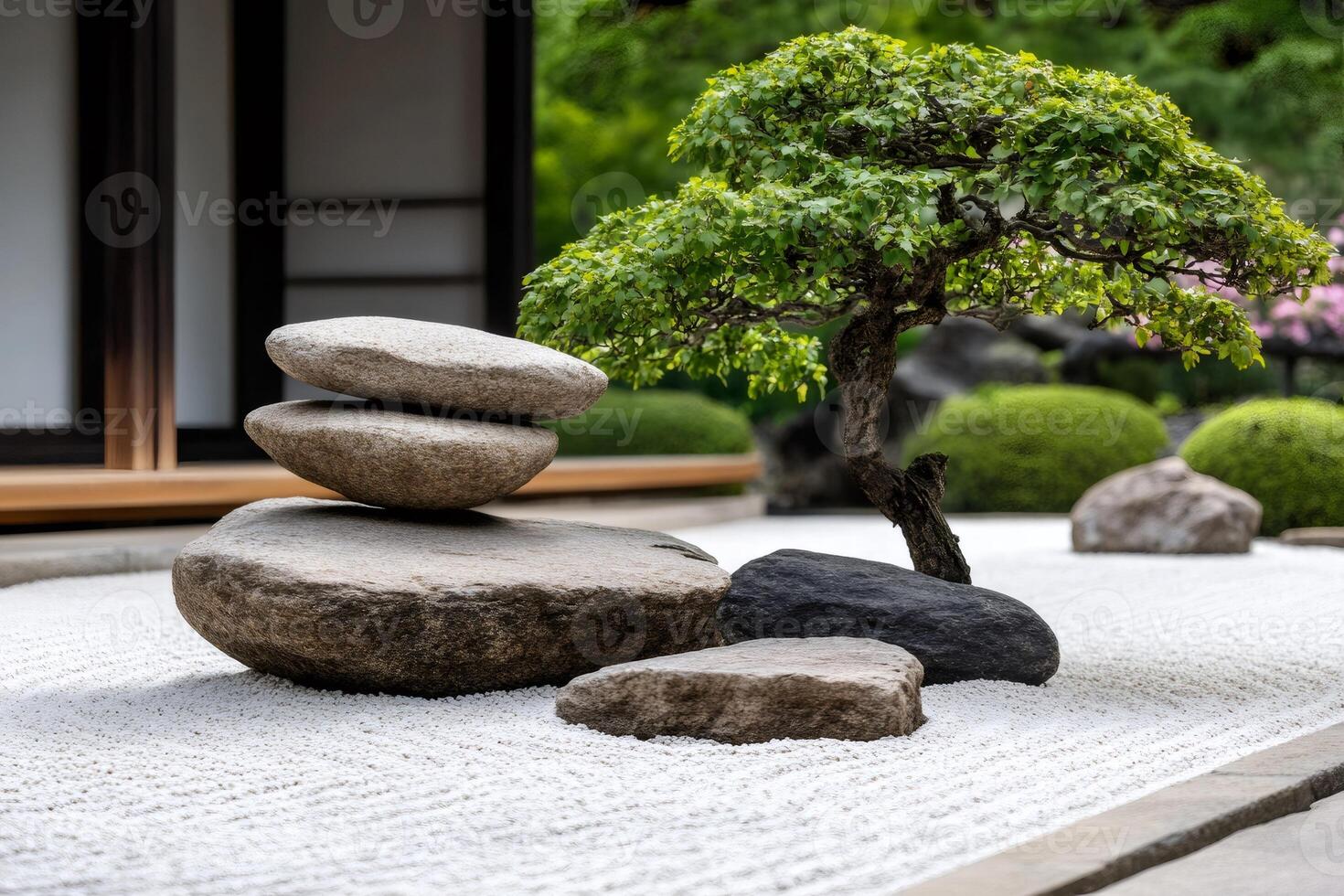 Zen garden with bonsai and stacked rocks representing balance and harmony photo