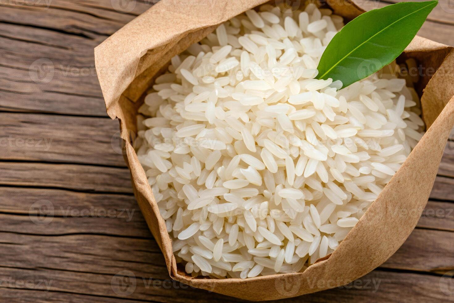 Raw white rice inside a paper bag on a wooden table photo
