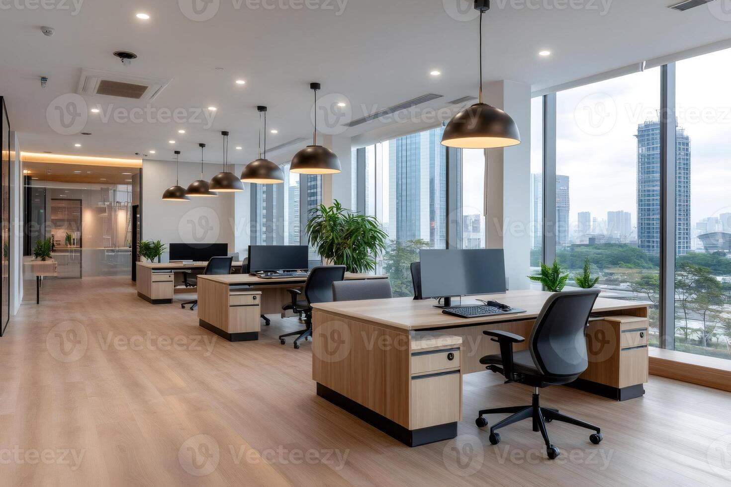 Empty coworking space with modern furniture and big windows overlooking a cityscape photo