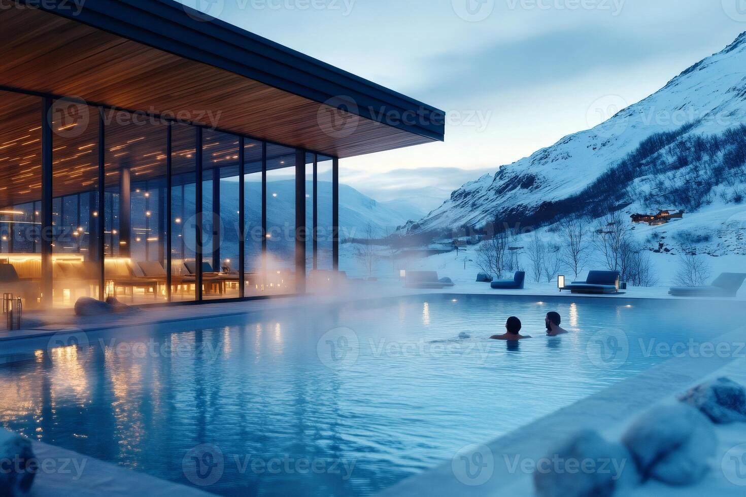 Tourists relaxing in infinity pool at luxury resort in snowy mountain landscape photo