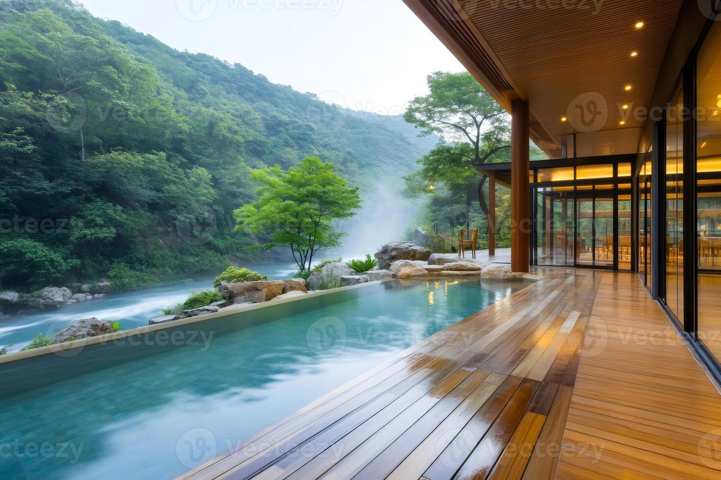 Luxurious onsen spa overlooking scenic river flowing through forested valley in Japan photo