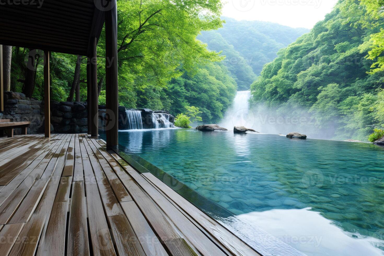 Infinity pool overlooking waterfall in pristine forest photo