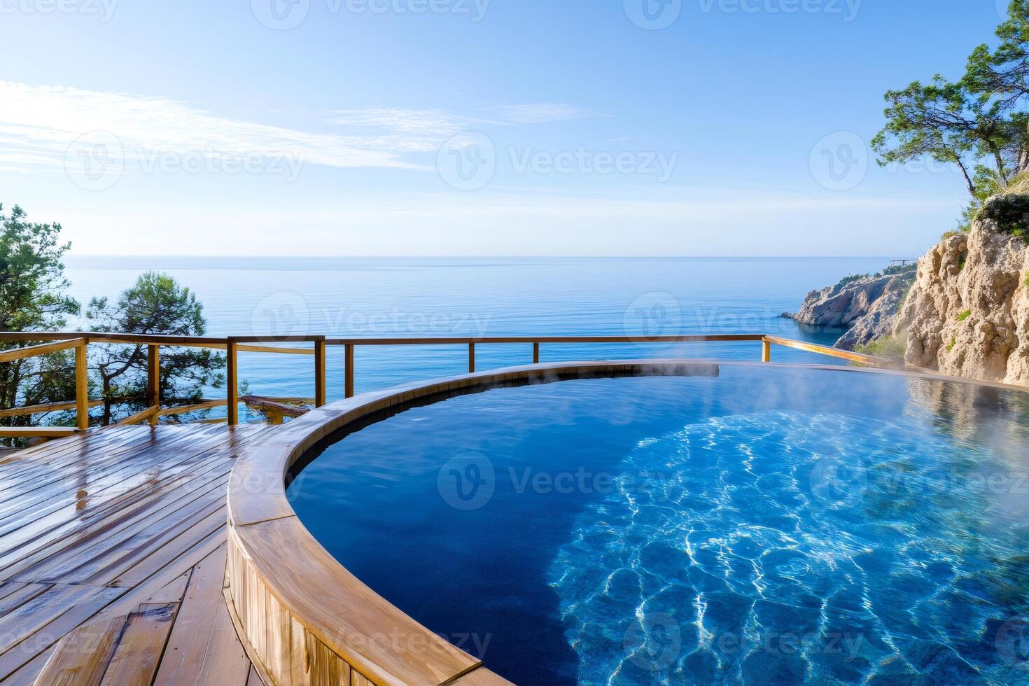 Steaming infinity pool overlooking the mediterranean sea from a luxury resort photo