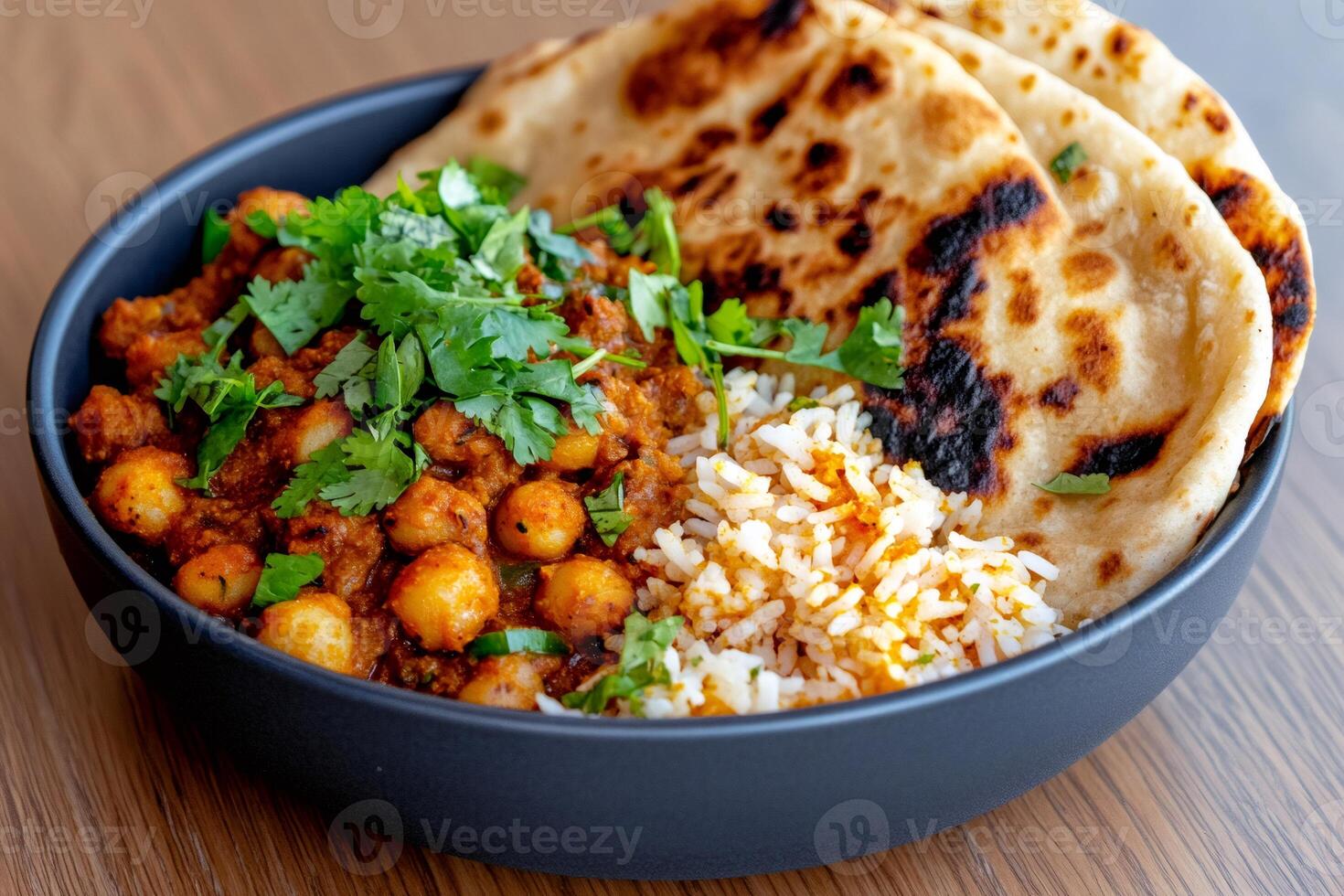 Chana Masala with Basmati Rice and Naan Bread in a Bowl photo