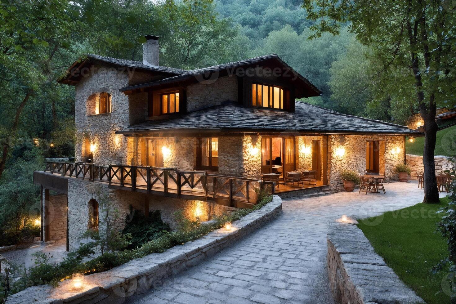 Charming stone house illuminating the forest at twilight photo