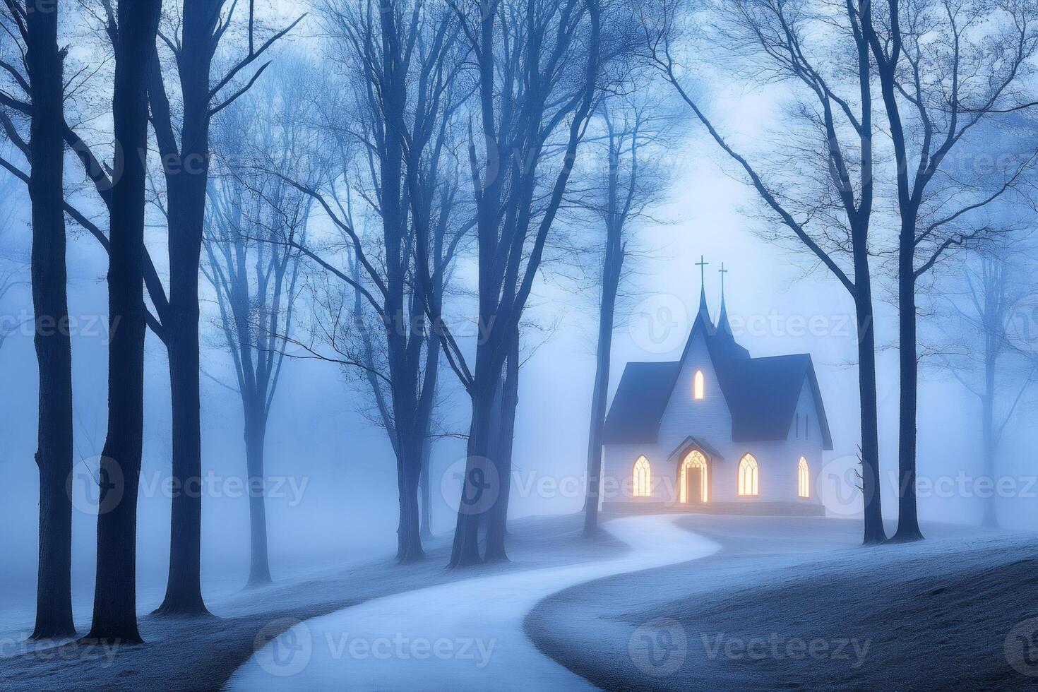 Winding path leading to illuminated church in foggy forest at dusk photo