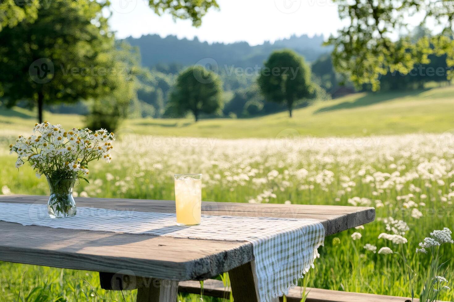 Refreshing lemonade and daisies enjoying summer in the countryside photo